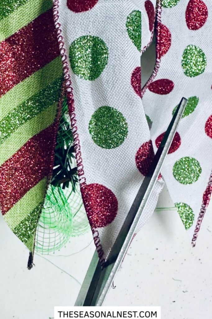 Trimming the ribbon tails with scissors