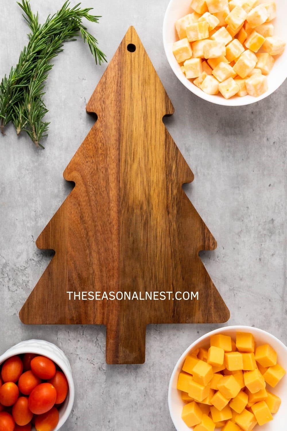 Christmas Tree Cheese Platter Ingredients and a cutting board.