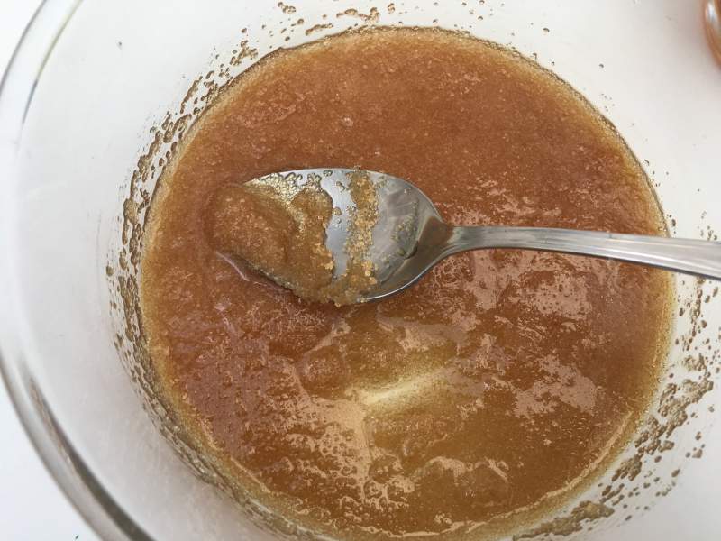 Brown sugar scrub in a bowl with a spoon