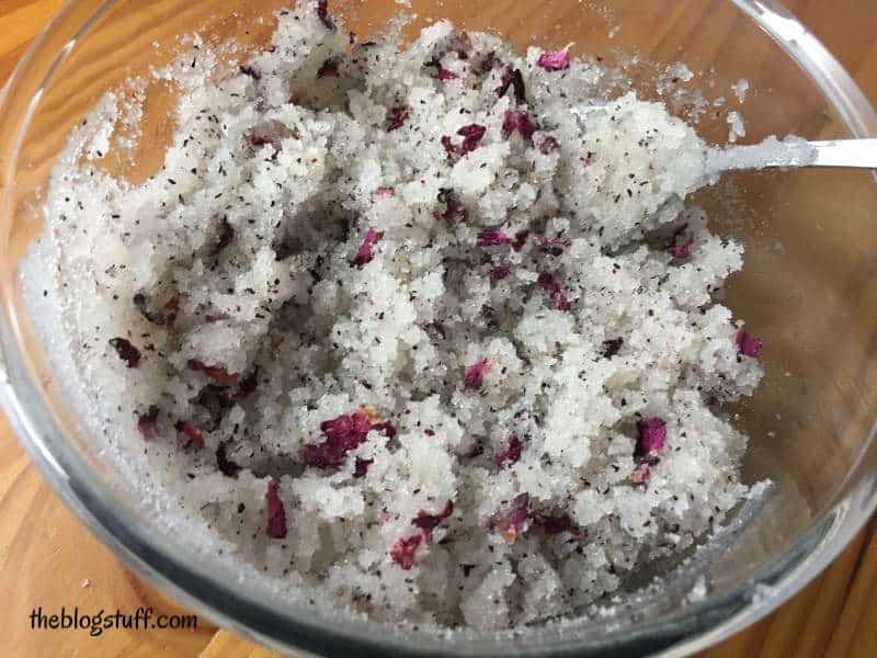 Stirring the sugar scrub mixture in a bowl