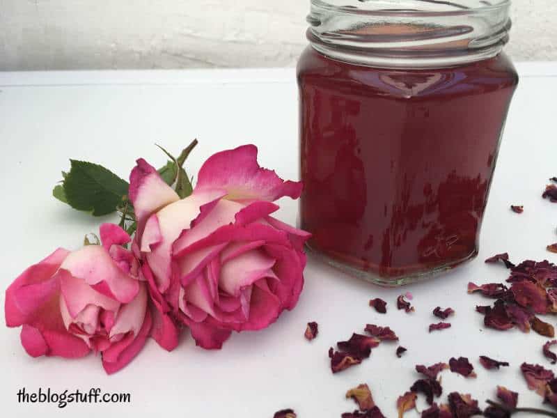 DIY rose water in a jar with 2 roses