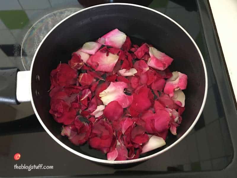 Rose petals in a pot with water