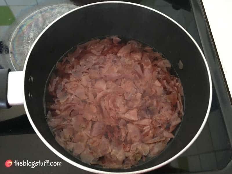 Simmering rose water petals in a pot