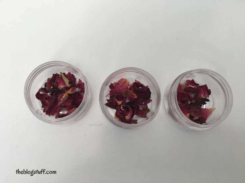 Dry rose petals on lip balm container