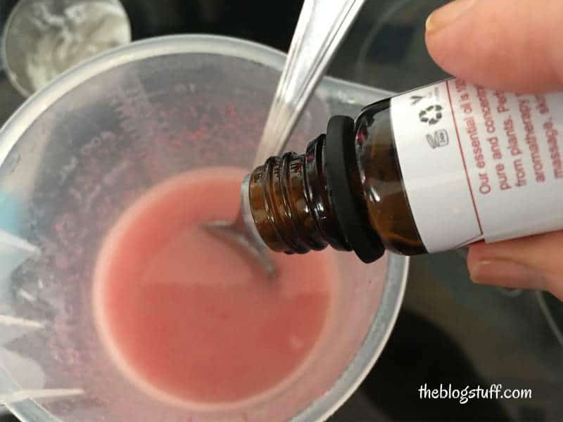 Adding rose essential oil to ingredients