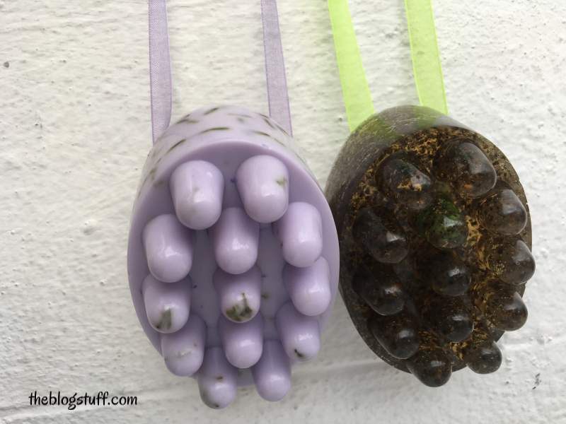 2 DIY massage soap bars hanging from a wall