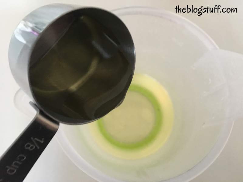 Adding sweet almond oil to lip balm mixture