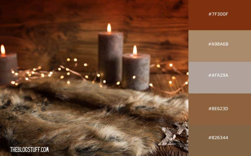 A cozy, rustic Christmas scene with brown candles, soft fairy lights, and a faux fur blanket, creating a warm, woodland holiday feel.