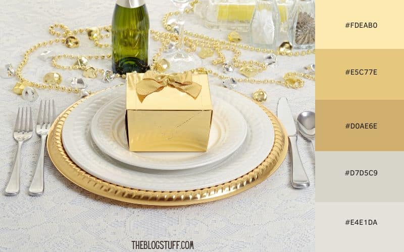 Elegant gold-themed Christmas table setting with gold accents, sparkling beads, and a festive gift box, creating a luxurious holiday atmosphere.