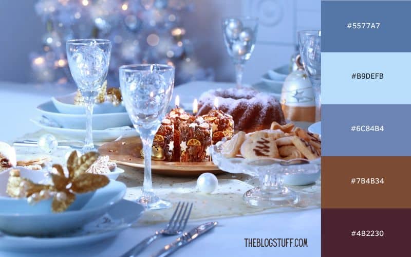 A festive holiday table setting with a Nordic-inspired blue and brown color palette. Crystal glasses and a snowy-blue theme set a cozy and elegant wintery atmosphere, perfect for a modern Christmas dinner celebration.