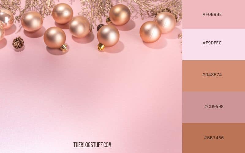 A pastel blush pink Christmas color palette featuring soft, metallic pink ornaments on a pale pink background. This elegant and modern holiday aesthetic creates a soft and delicate festive vibe, perfect for a unique and feminine holiday decor.