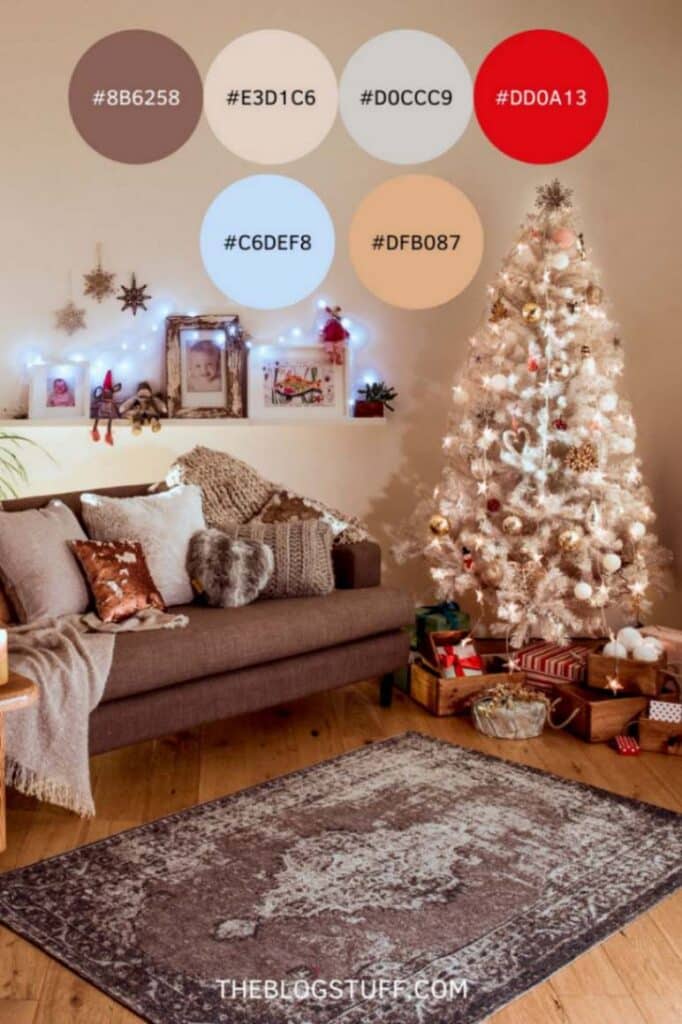 This image displays a cozy, Nordic neutral living room with a Christmas tree decorated in soft white and gold. The color palette includes muted browns, warm beige, soft blue, and a touch of festive red.