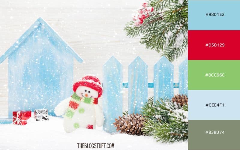 A cute winter scene with a snowman, blue fence, and festive red and green accents. Perfect for cozy outdoor Christmas decor with an icy holiday feel.