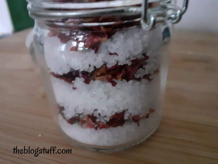 Layered bath salts in a glass container