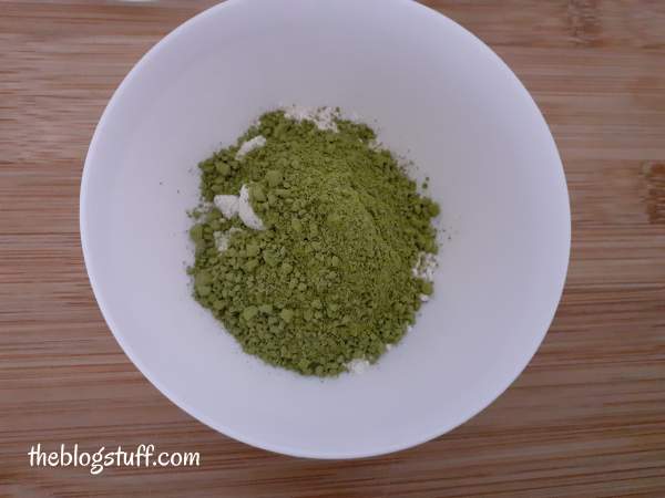 Mixing matcha powder and ground oats