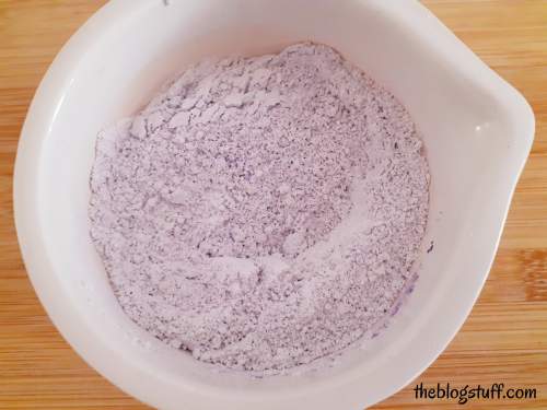 Mixed clay powder, ground lavender seeds, and purple mica