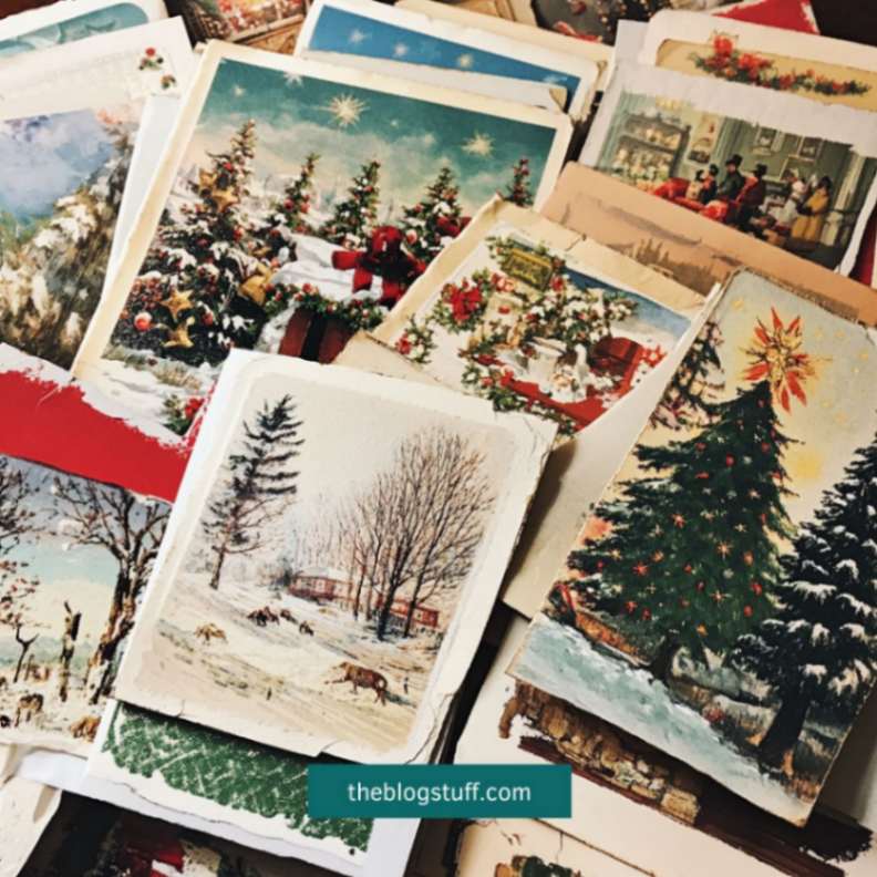 A stack of vintage Christmas postcards with nostalgic holiday scenes, featuring snow-covered landscapes, decorated Christmas trees, and festive gatherings.