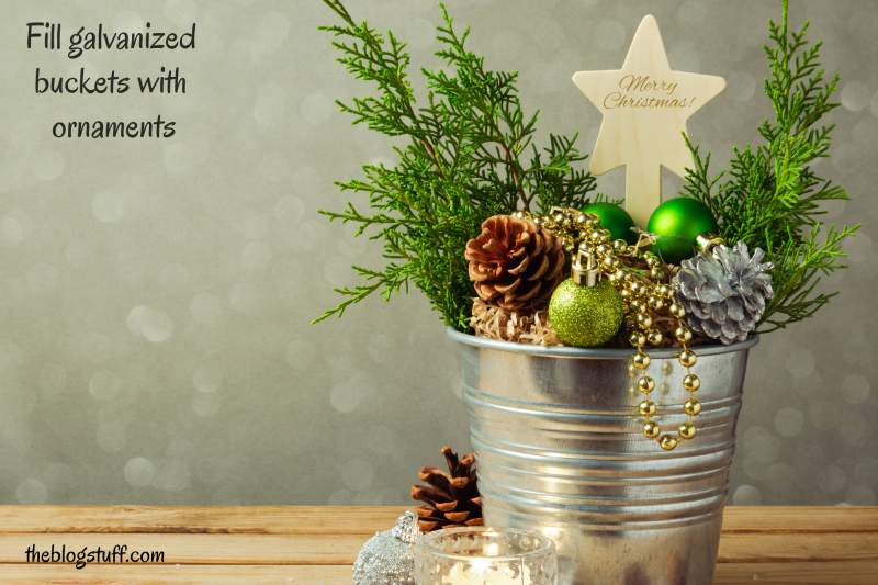 Galvanized bucket filled with Christmas decorations