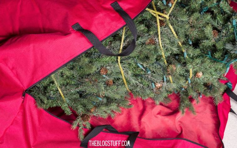 Storing a Christmas tree in a red bag