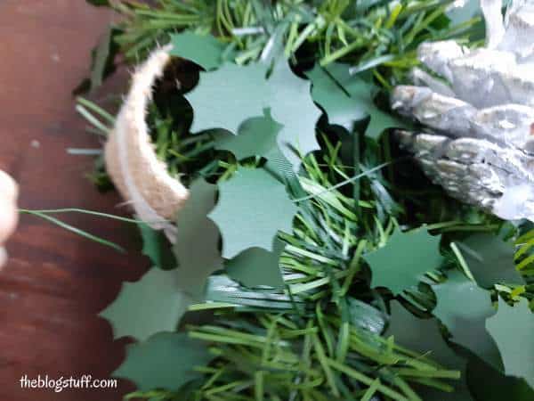 wrap pine cone wire around wreath