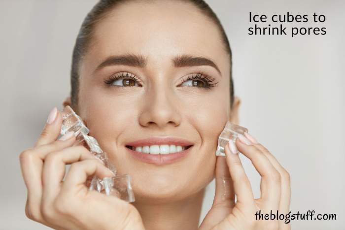 A woman applies ice cubes on her face to shrink pores