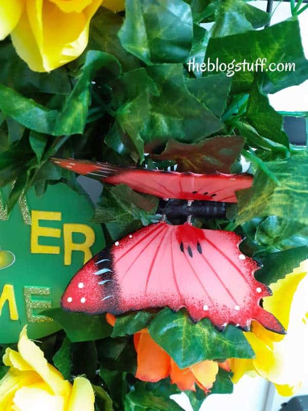 Attaching a butterfly to the summer wreath