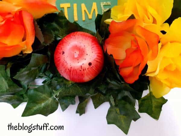 Attaching ornaments to the wreath