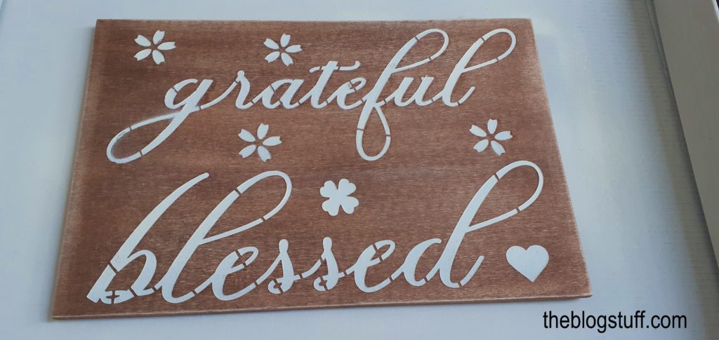 Finished wooden sign with the words grateful and blessed