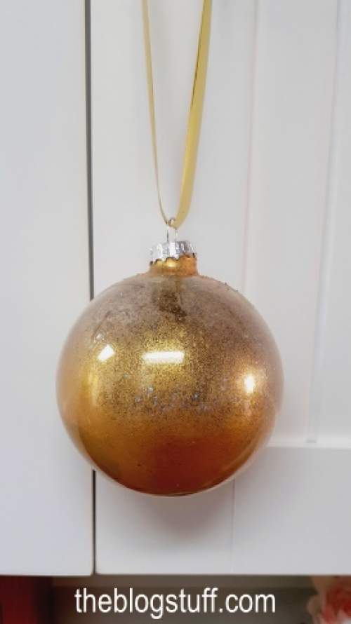 DIY Christmas bauble embellished with gold glitter