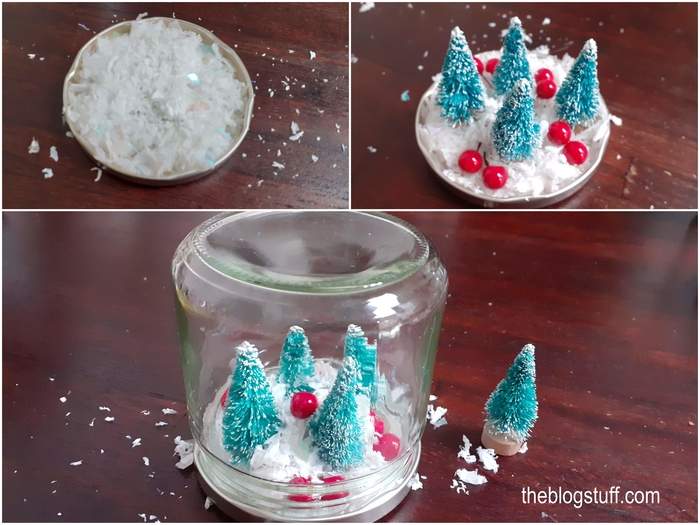 Decorating a glass jar with Christmas ornaments