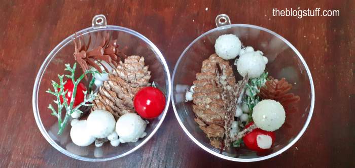 Open in half DIY Christmas bauble decorated with rustic  miniatures