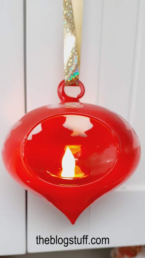 DIY decorated Christmas bauble with a faux candle