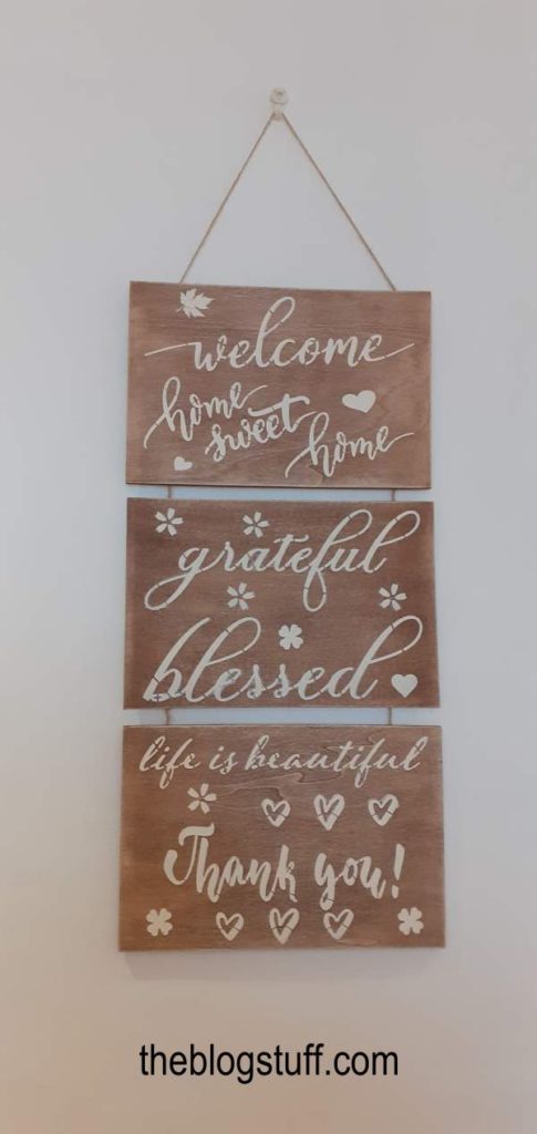 DIY wooden sign hanging from a wall