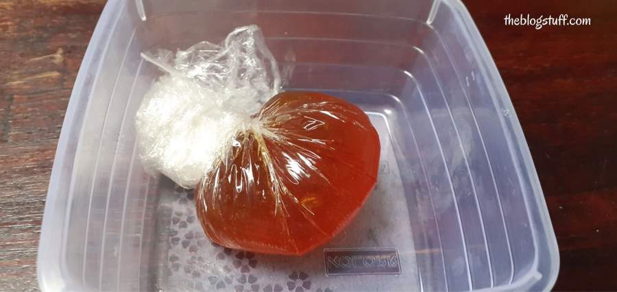 Diy sugar wax wrapped in plastic in a container