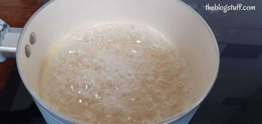 DIY sugar wax lime juice boiling in a saucepan