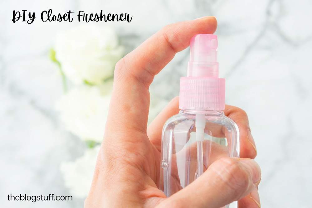 Hand holding DIY spray closet freshener