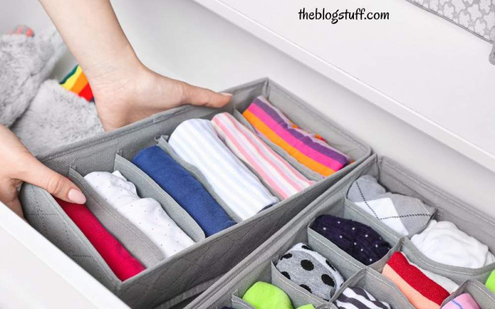 Organizing baby clothes with drawer dividers