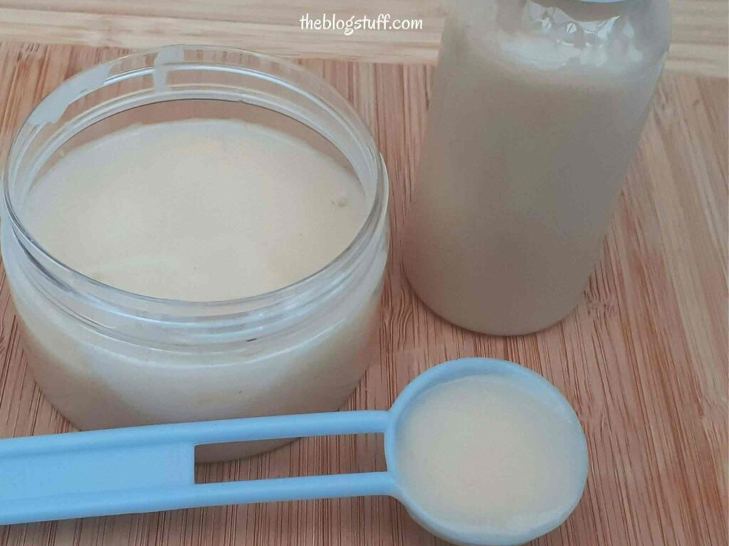 DIY curly hair cream conditioner in a container with a blue spoon