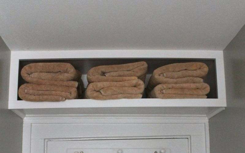 Towel storage above a bathroom door