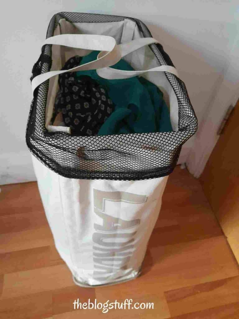 A laundry basket with dirty clothes