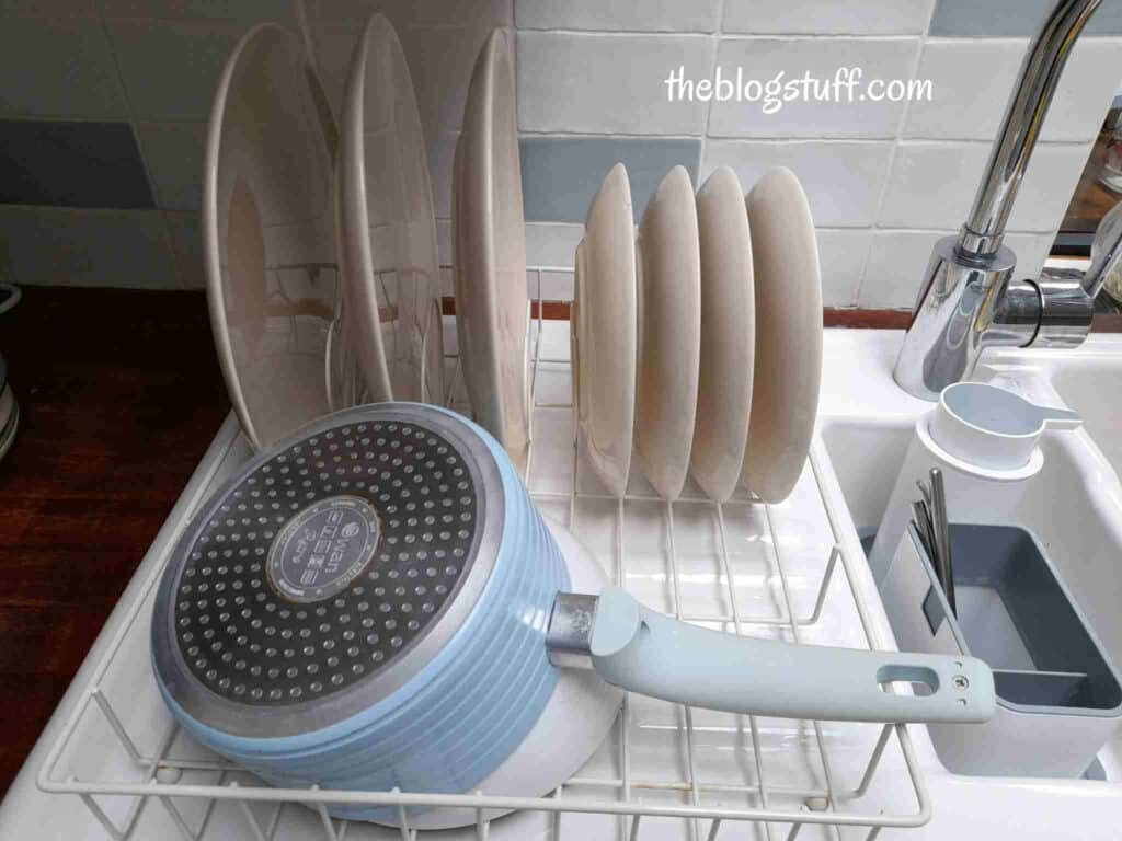 Drying kitchen pots and plates on a drying rack