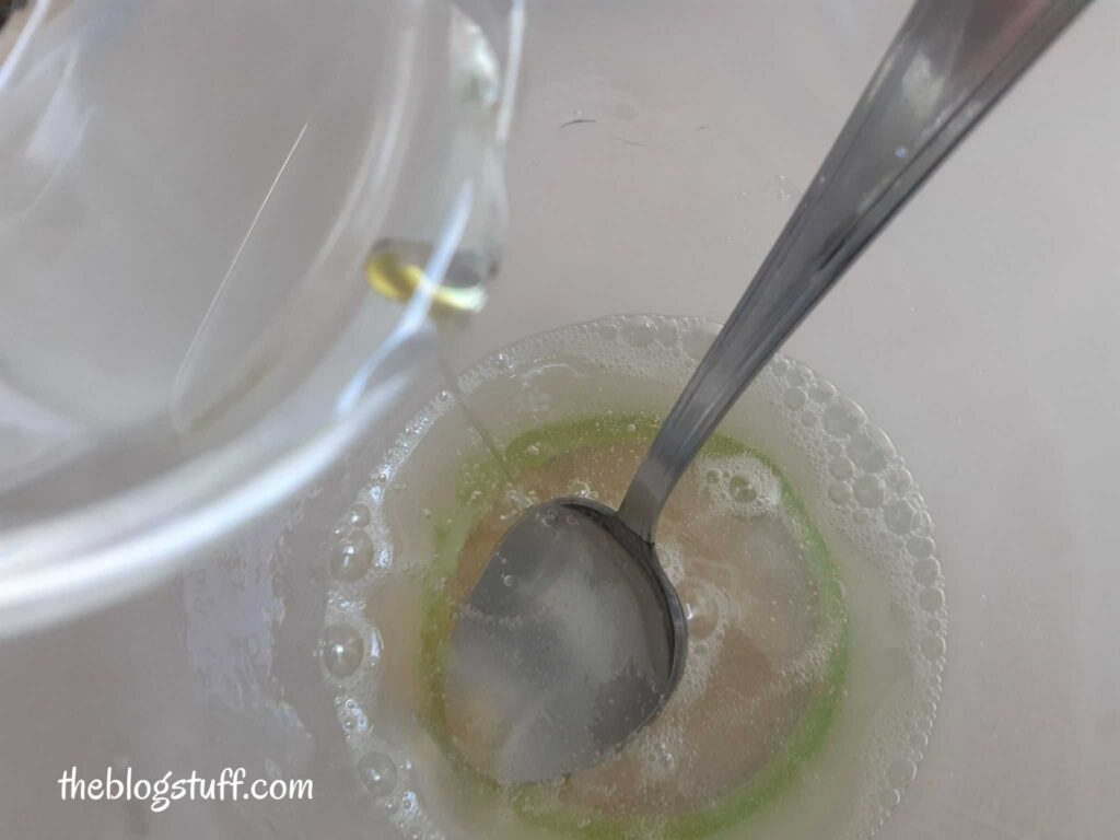 Pouring melted glycerin soap into a container