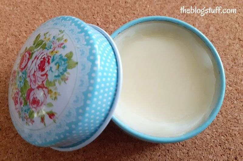 Homemade hair balm in a tin container