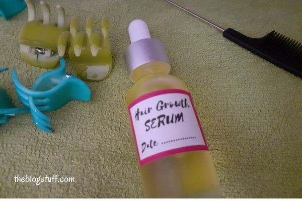 DIY hair growth serum in a bottle with hair accessories