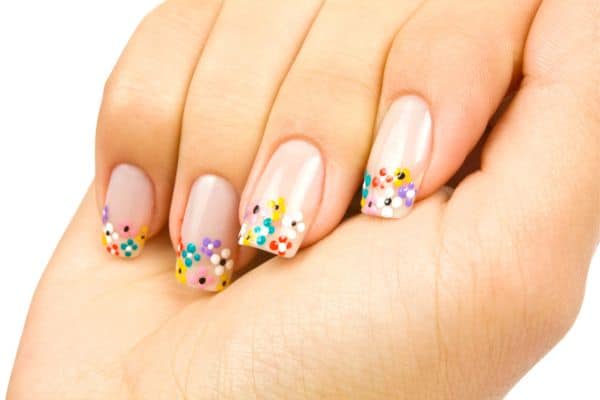 Transparent square nails with tiny colorful flowers at the tips