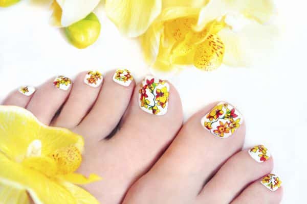 Toes nails with a colorful spring floral design