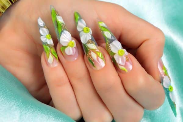 Stiletto nails with green and white spring flowers