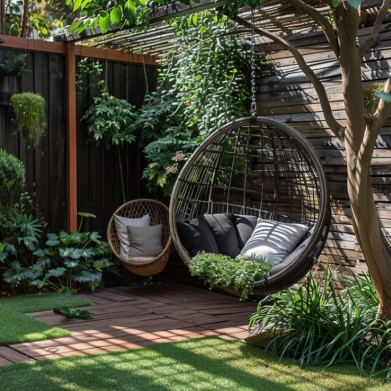 Swing chair hanging from a tree in a small backyard