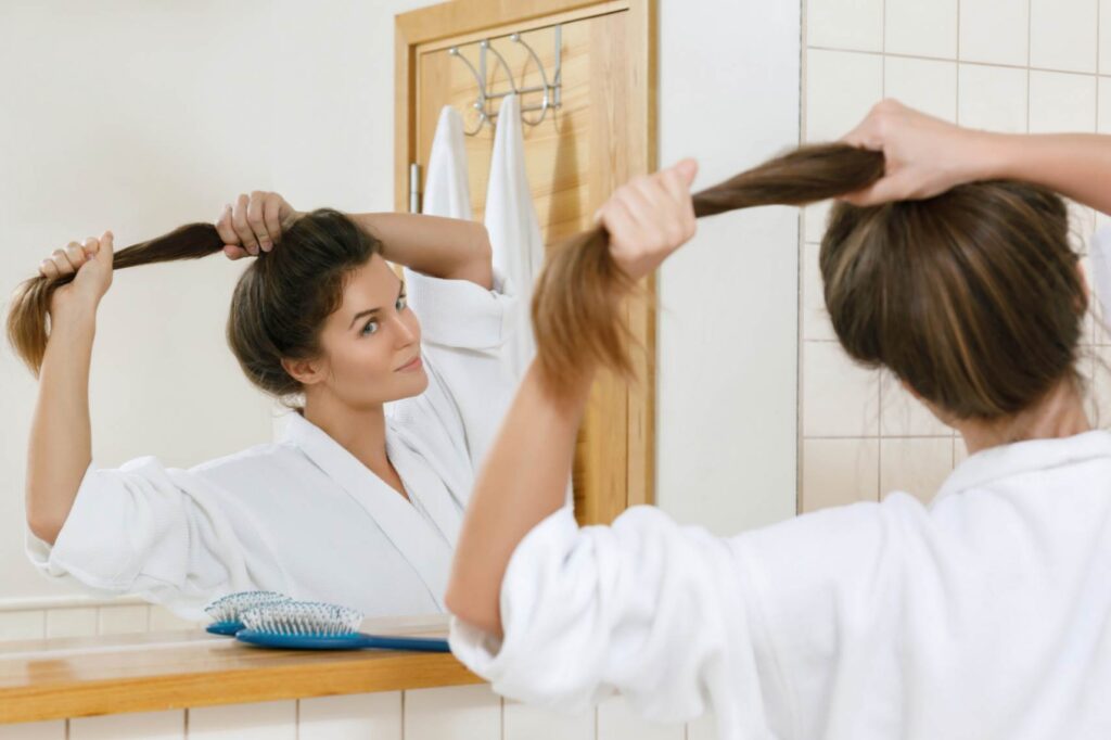 A woman styling her hair