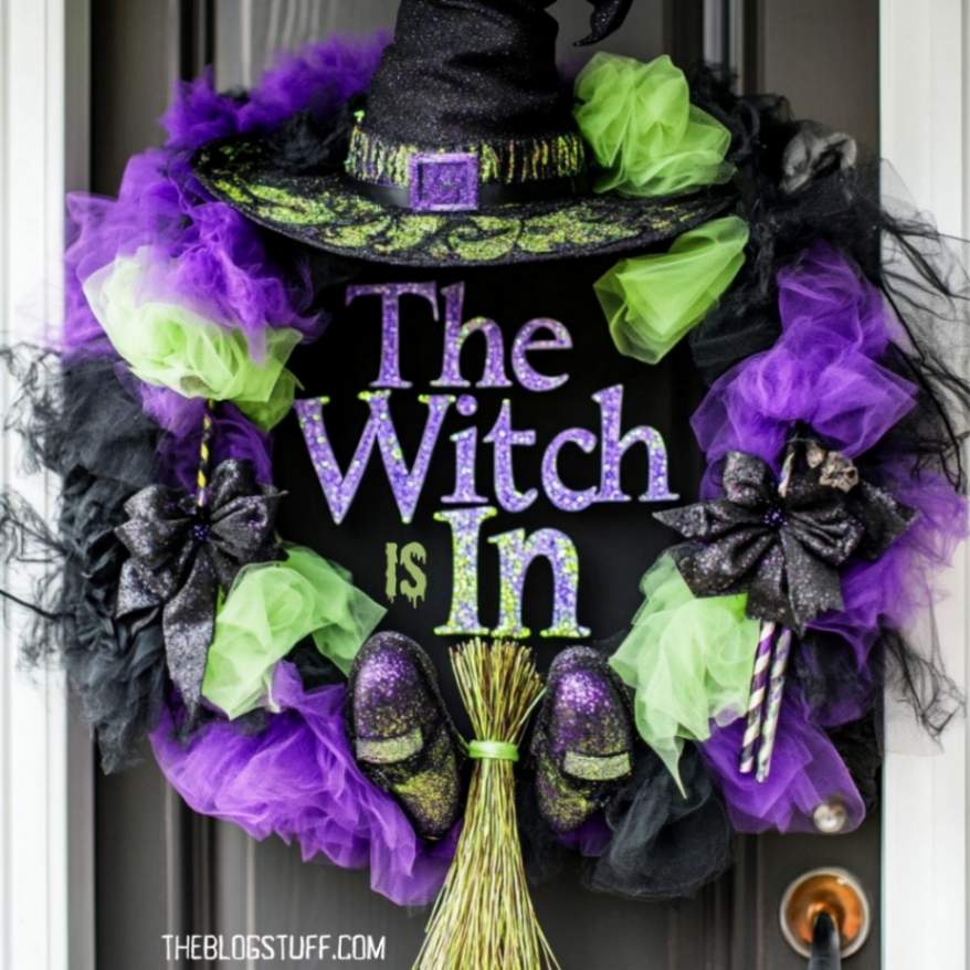 A Halloween wreath with a "The Witch is In" sign and a witch hat.